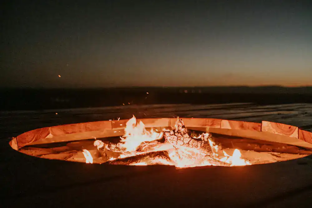 Cosy outdoor fire pit with blankets